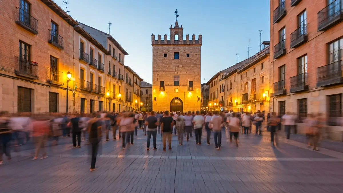Generic image of a bustling historic square during a festive event.