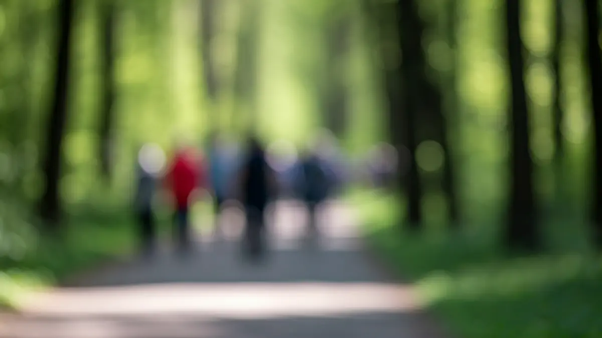 Generic image of people walking on a natural path, symbolizing unity and coexistence.