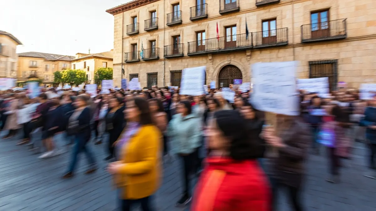 Image of a community march for equality in front of a town hall.