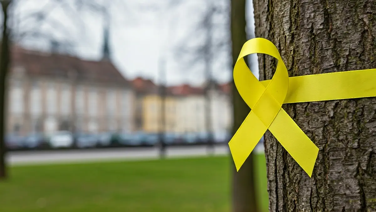 Generic image of a yellow ribbon tied to a tree branch, symbolizing a protest.