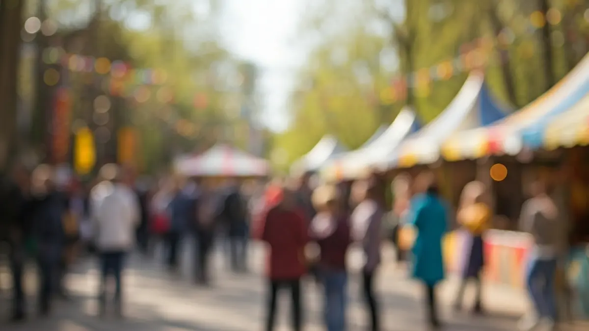 Image of a cultural festival with various activities and an audience in an urban park.
