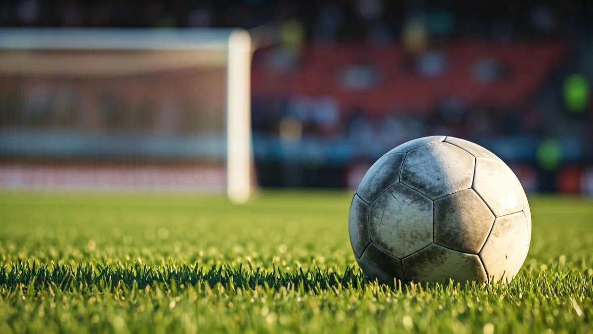 Generic image of a soccer ball on a stadium pitch.