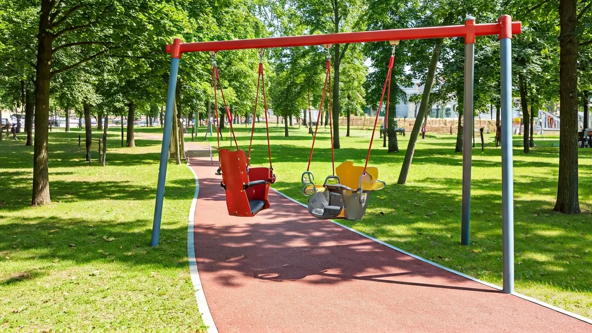 Inclusive swing and accessible walkway in a children's park.