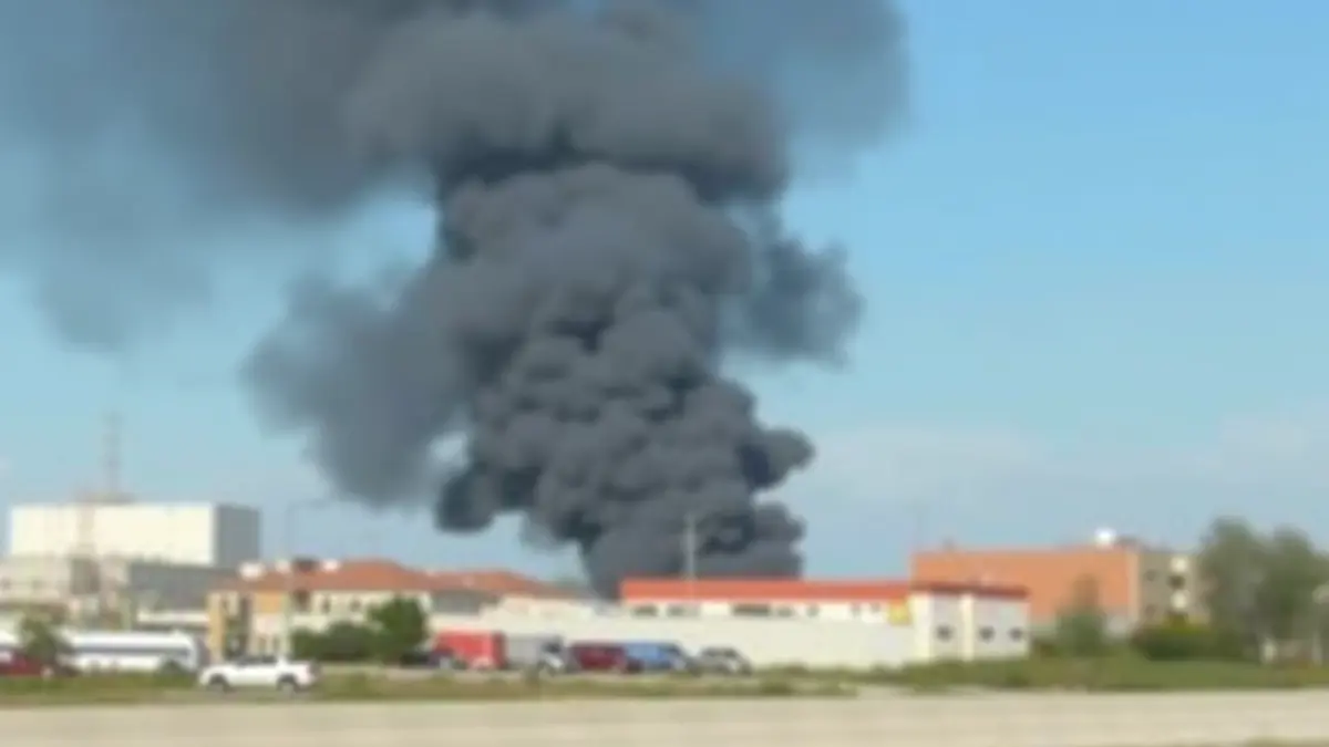 Generic image of a column of smoke rising over an industrial area.