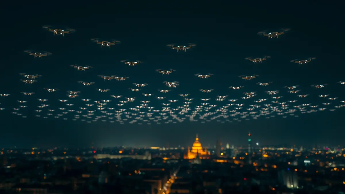 Drone show illuminating the night sky over Madrid.