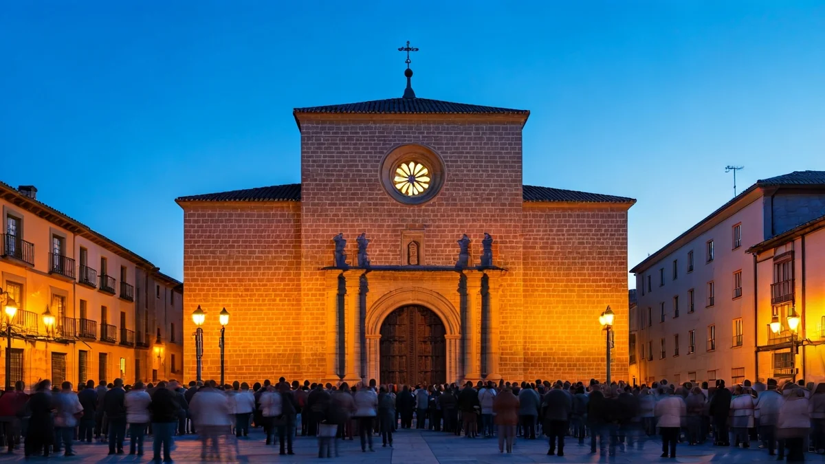 Imagen de una iglesia tradicional española al anochecer durante la Semana Santa.