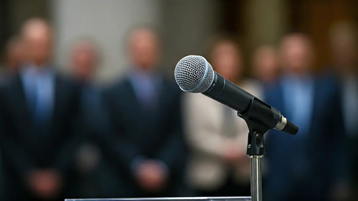 Generic image of a microphone on a podium, symbolizing a political speech.
