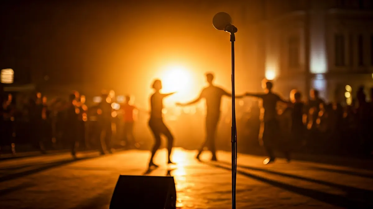 Generic image of a stage with a microphone and dancers, representing a dance event.