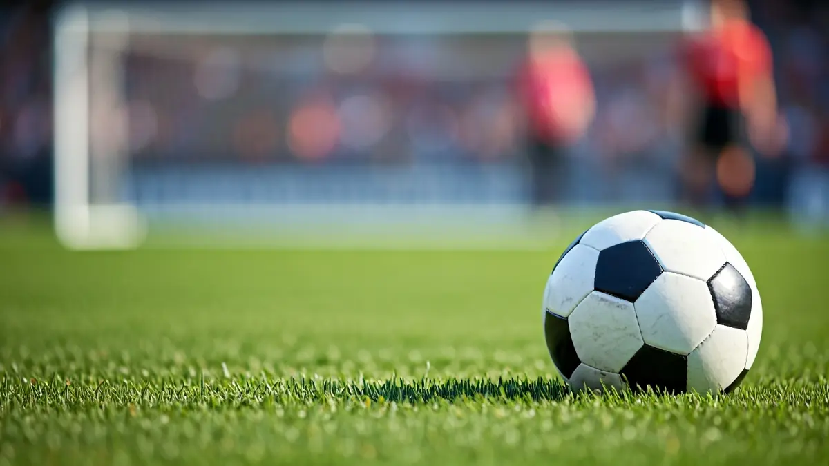 Generic image of a soccer ball on a grass field.