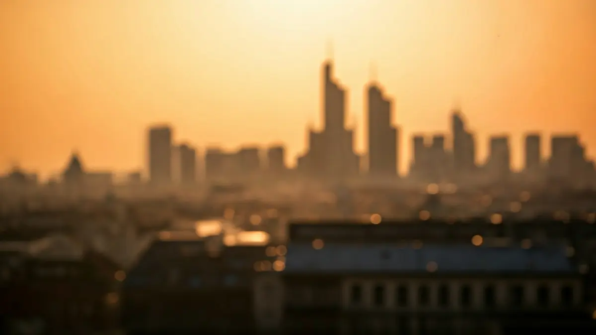 Generic image of a hazy, orange sky over a city, indicating airborne dust.