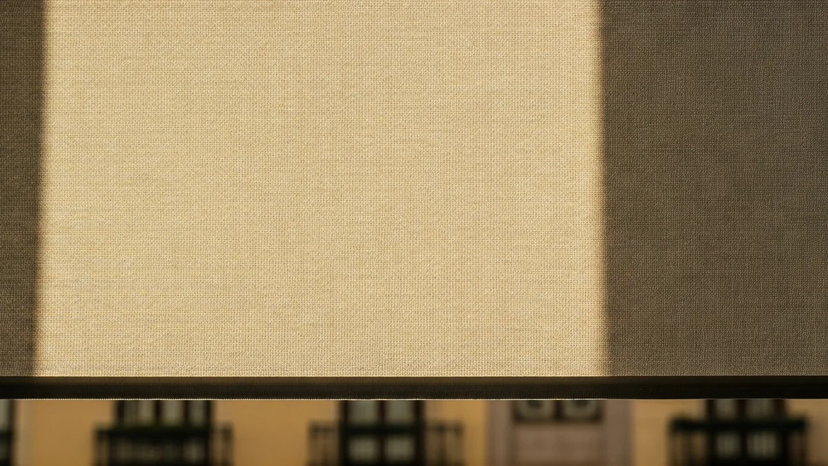 Generic image of a modern awning protecting a window from the sun on an urban building.