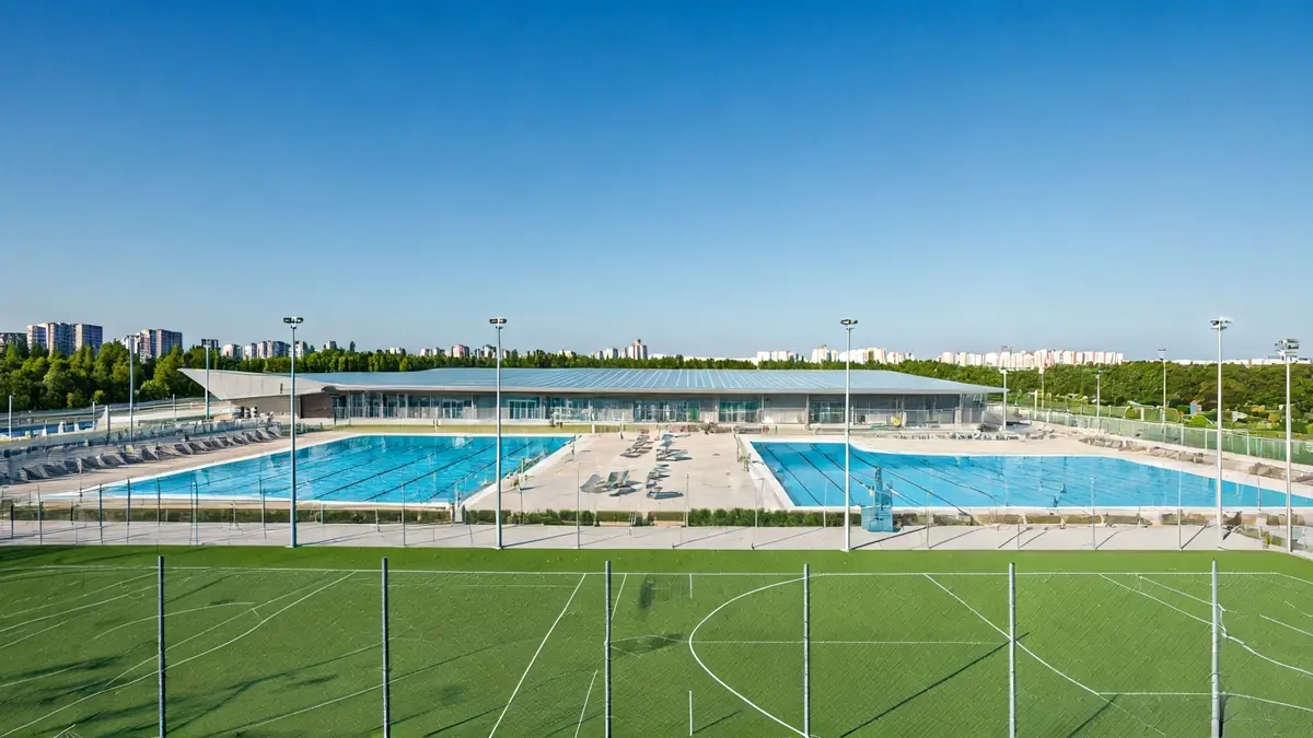 Image of a modern sports complex with swimming pools and a gym.