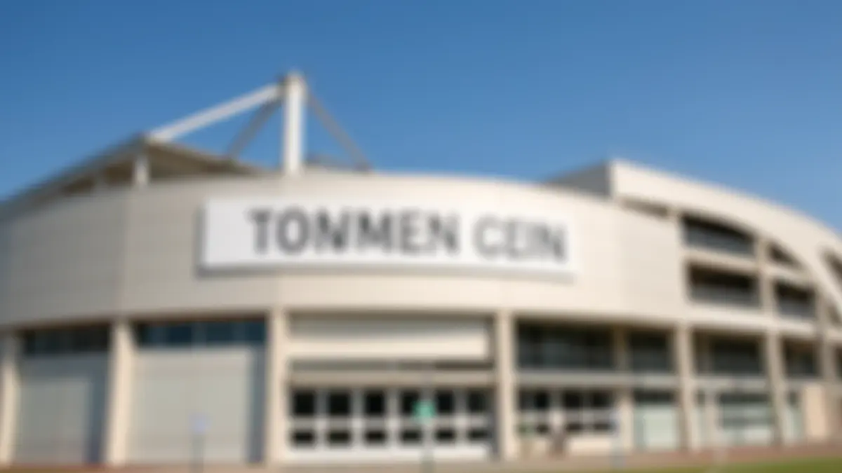 Generic facade of a sports facility with a blurred large sign.