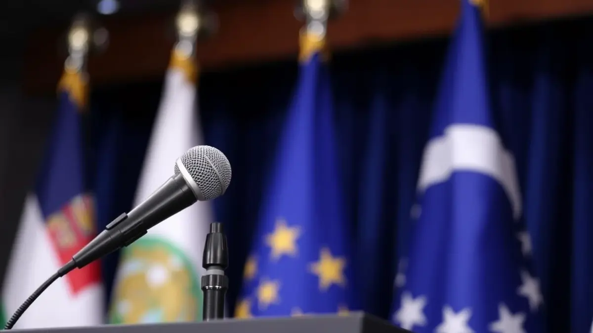 Generic image of a microphone on a podium, symbolizing a political announcement or official statement.