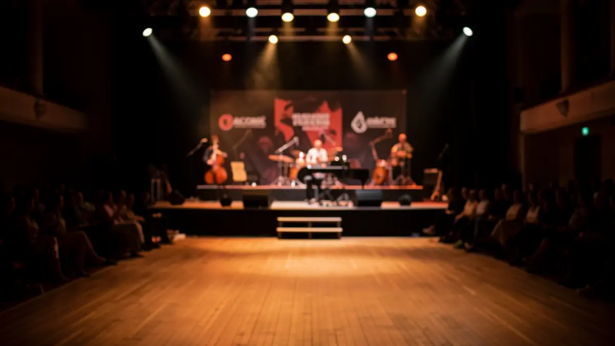 Generic image of an empty concert stage in Alcorcón with warm lighting.