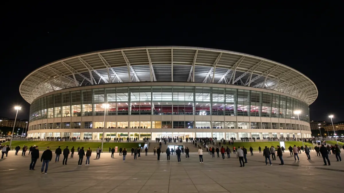 Image of the Santiago Bernabéu Stadium in Madrid at night.